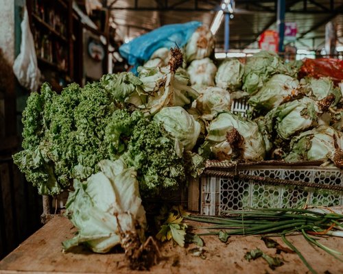 A variety of fresh green vegetables on a local market counter in Poland