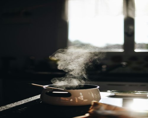 Traditional Polish hot soup steaming gently in a modern minimalist kitchen setting